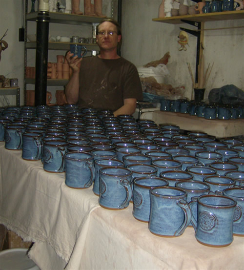 Karsten holding one of 175 matching Wakonse mugs
